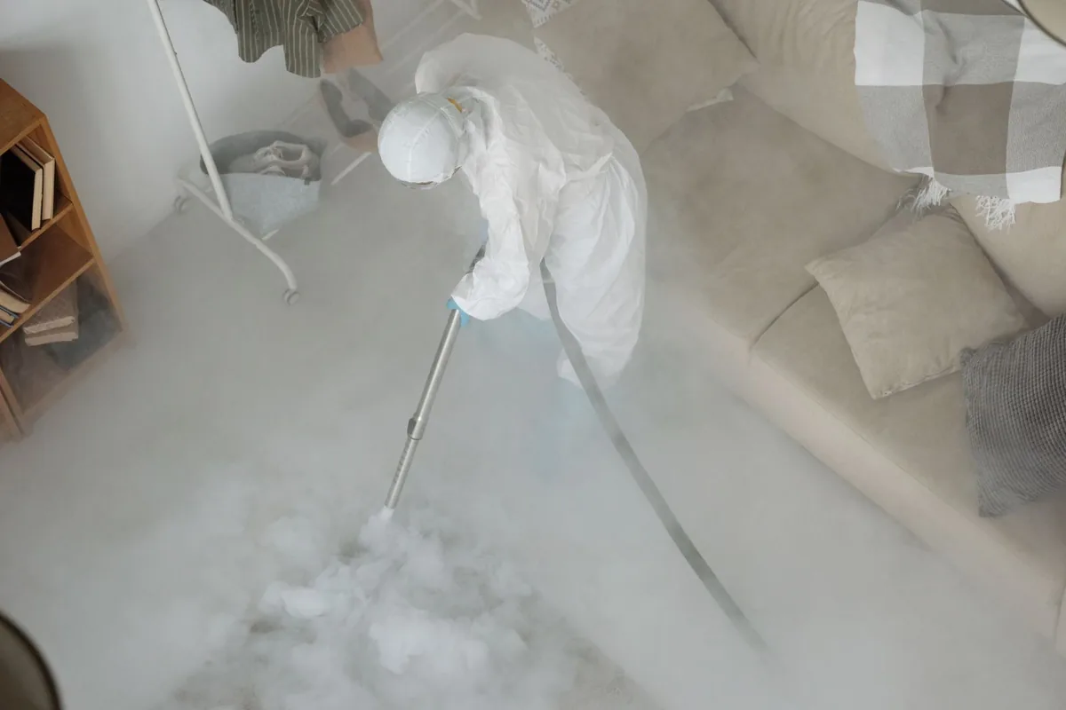 Biohazard cleanup technician in protective equipment, Mead, WA